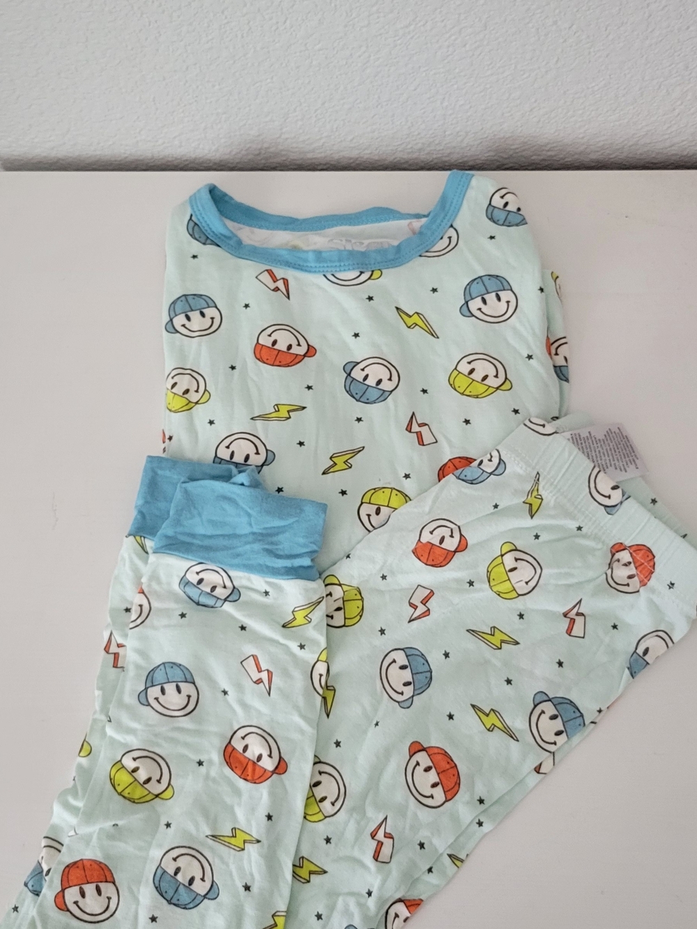 Sleep On It Light Blue Smiley Face Print Footie with Orange and Yellow Accents